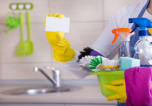 Cleaner sanitizing a modern kitchen during one off cleaning
