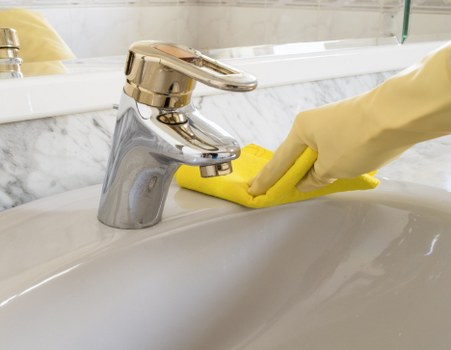 Scheduled office cleaning checklist beside workspace
